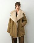 Model wearing Fireladyfur Modern Introduction Khaki Sheepskin goose down parka with Tuscan wool collar front view