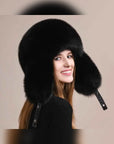 Women's fox fur trapper hat with earmuffs in Black – styled on model | Firelady Fur