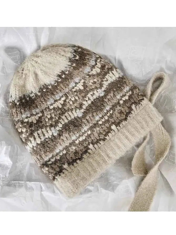 Women's khaki jacquard knitted winter hat in product packaging