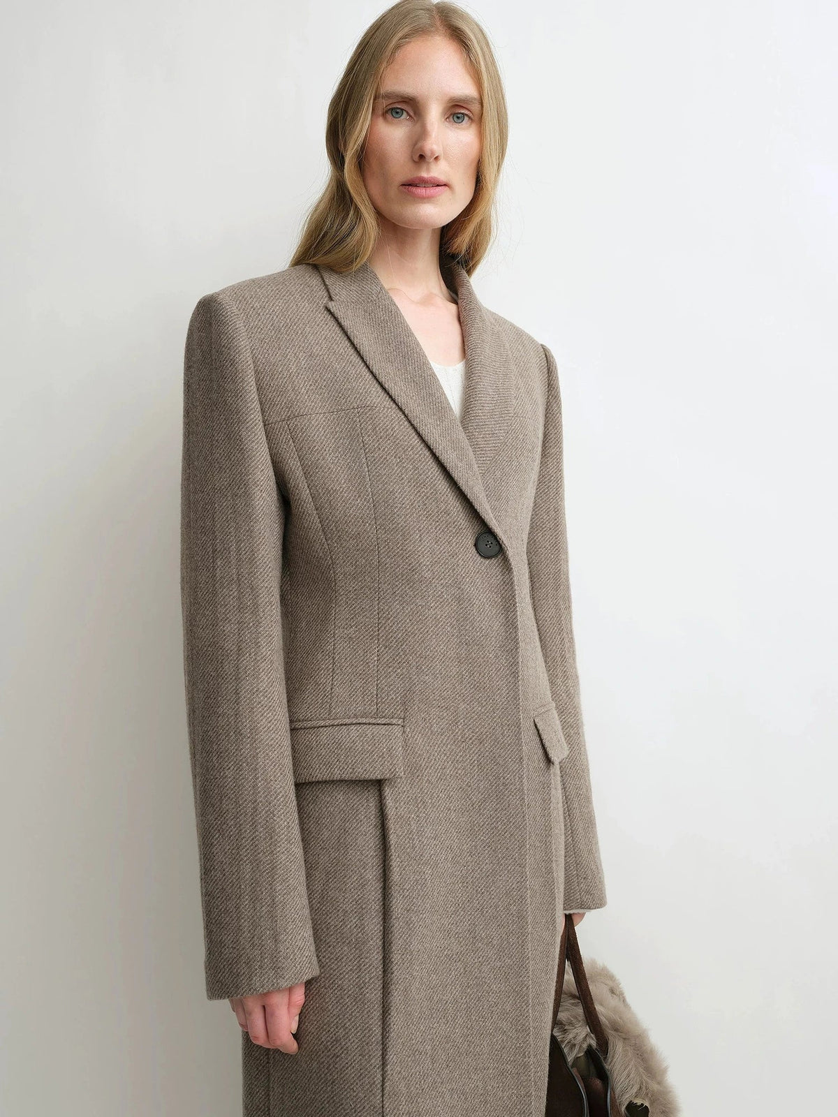 THE ARTM taupe brown wool long coat lapel and waist close-up