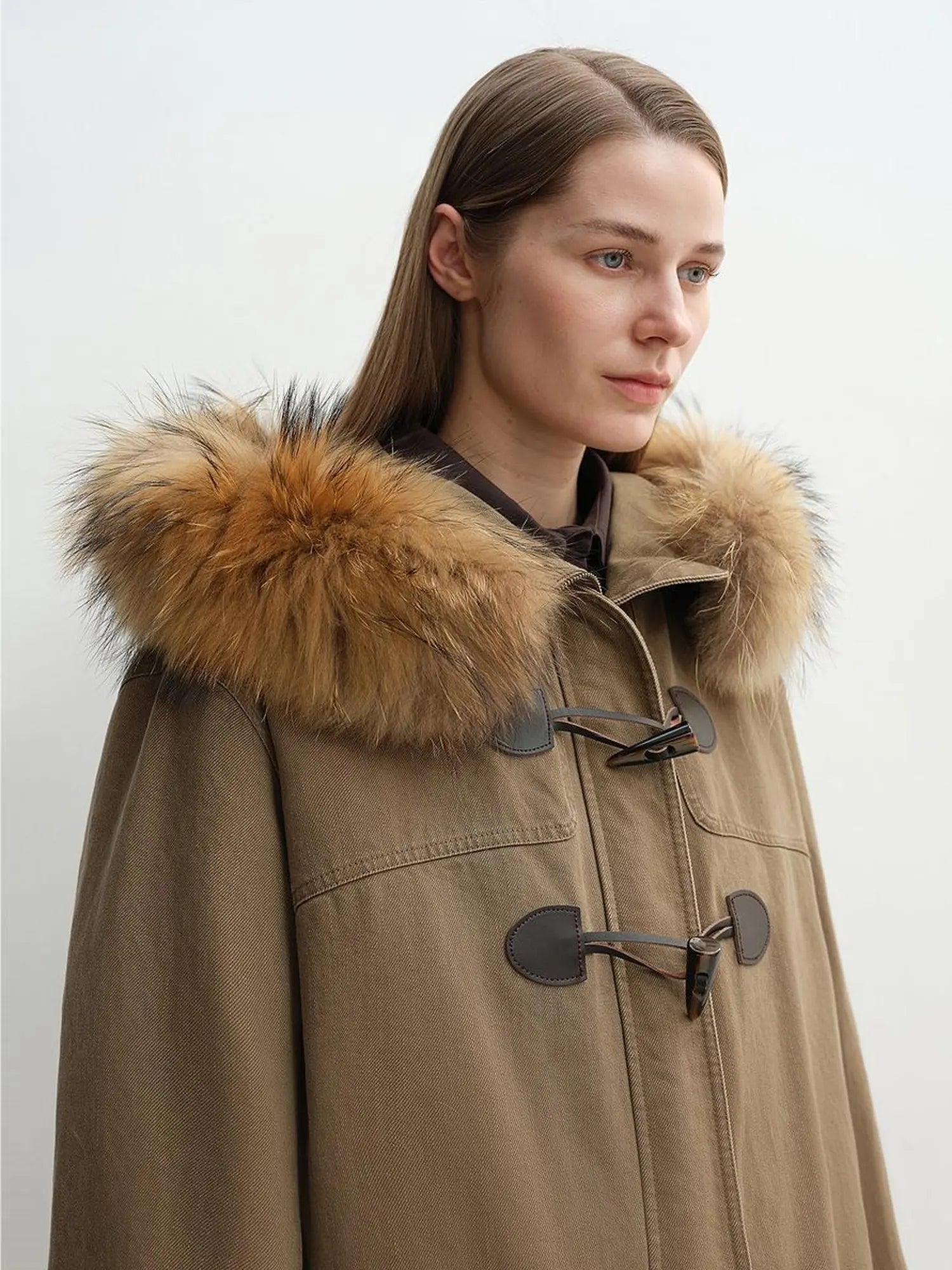 Close-up of Letrans Muye Kingdom detachable raccoon fur collar and toggle closure