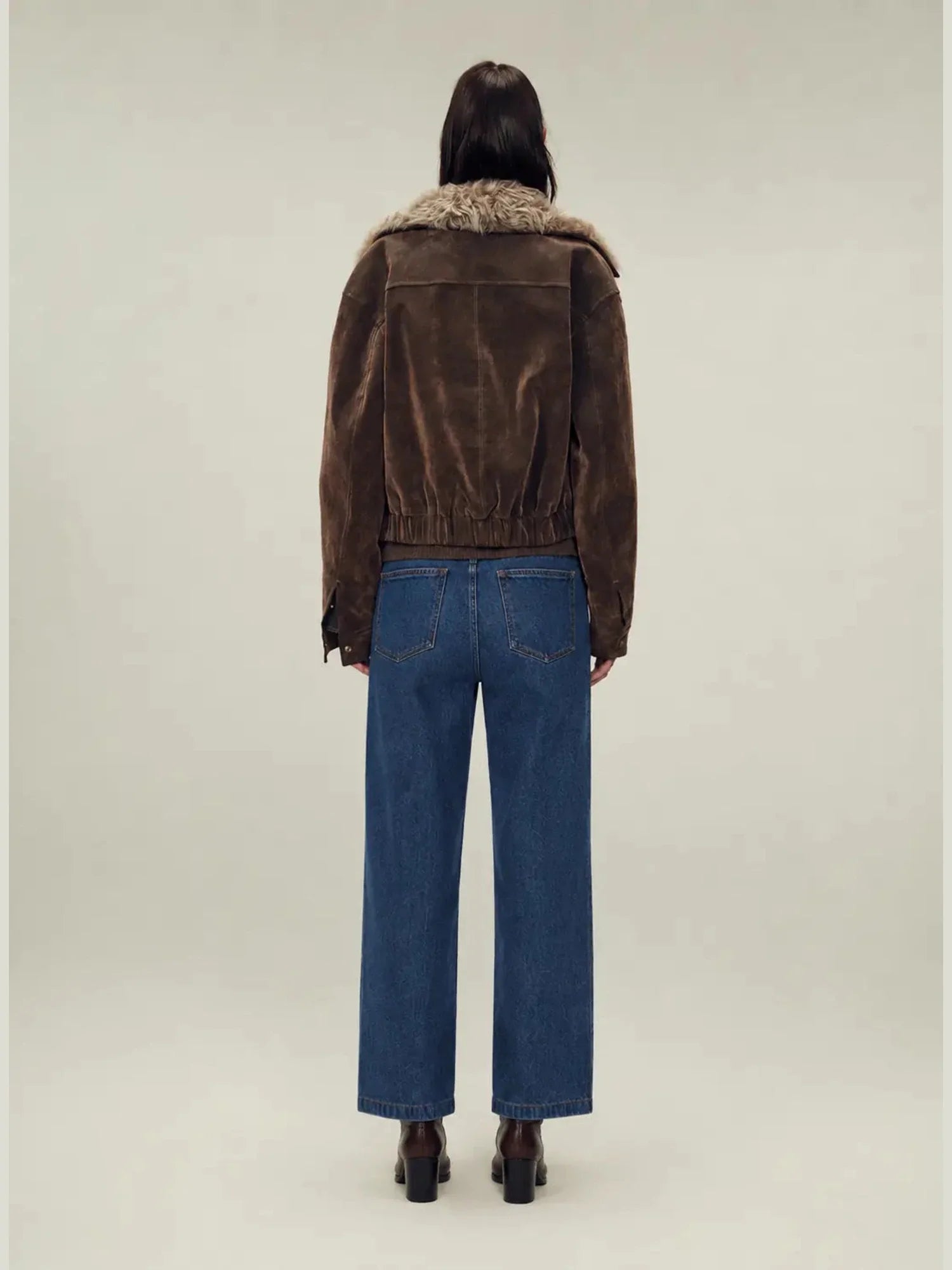 Back view of Firelady Fur Wander Free chestnut brown denim parka with detachable fur collar