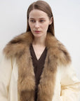 Close-up of Fireladyfur Day and Night Rider off-white down jacket with contrasting fox fur collar