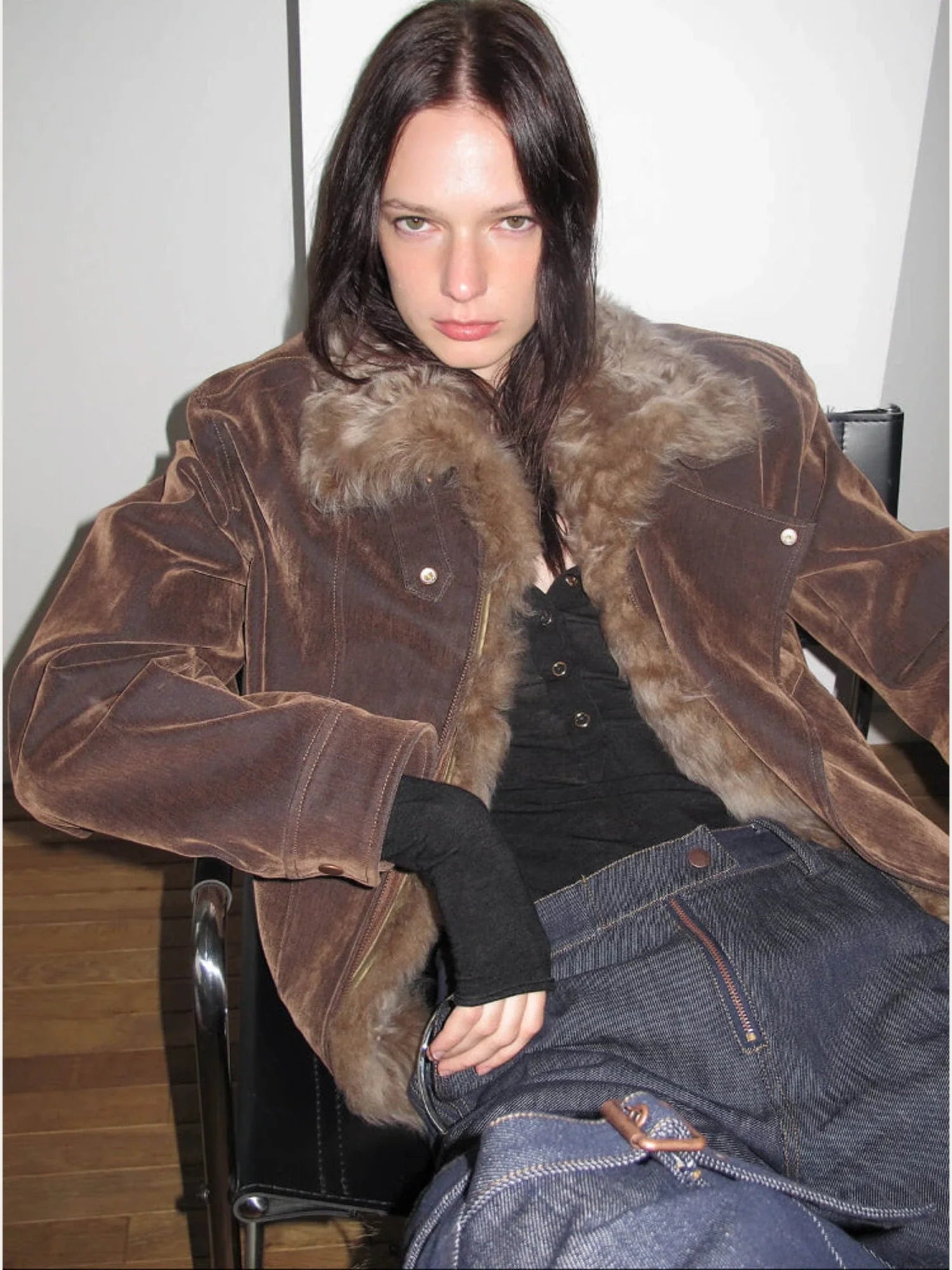Seated close-up of Firelady Fur Wander Free chestnut brown denim parka with detachable fur collar