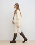 Side walking model view of Fireladyfur Day and Night Rider off-white detachable fox fur collar down jacket