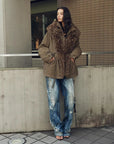 Street styling of Firelady Fur The Wizard of Oz gray green Toscana shearling lined parka jacket