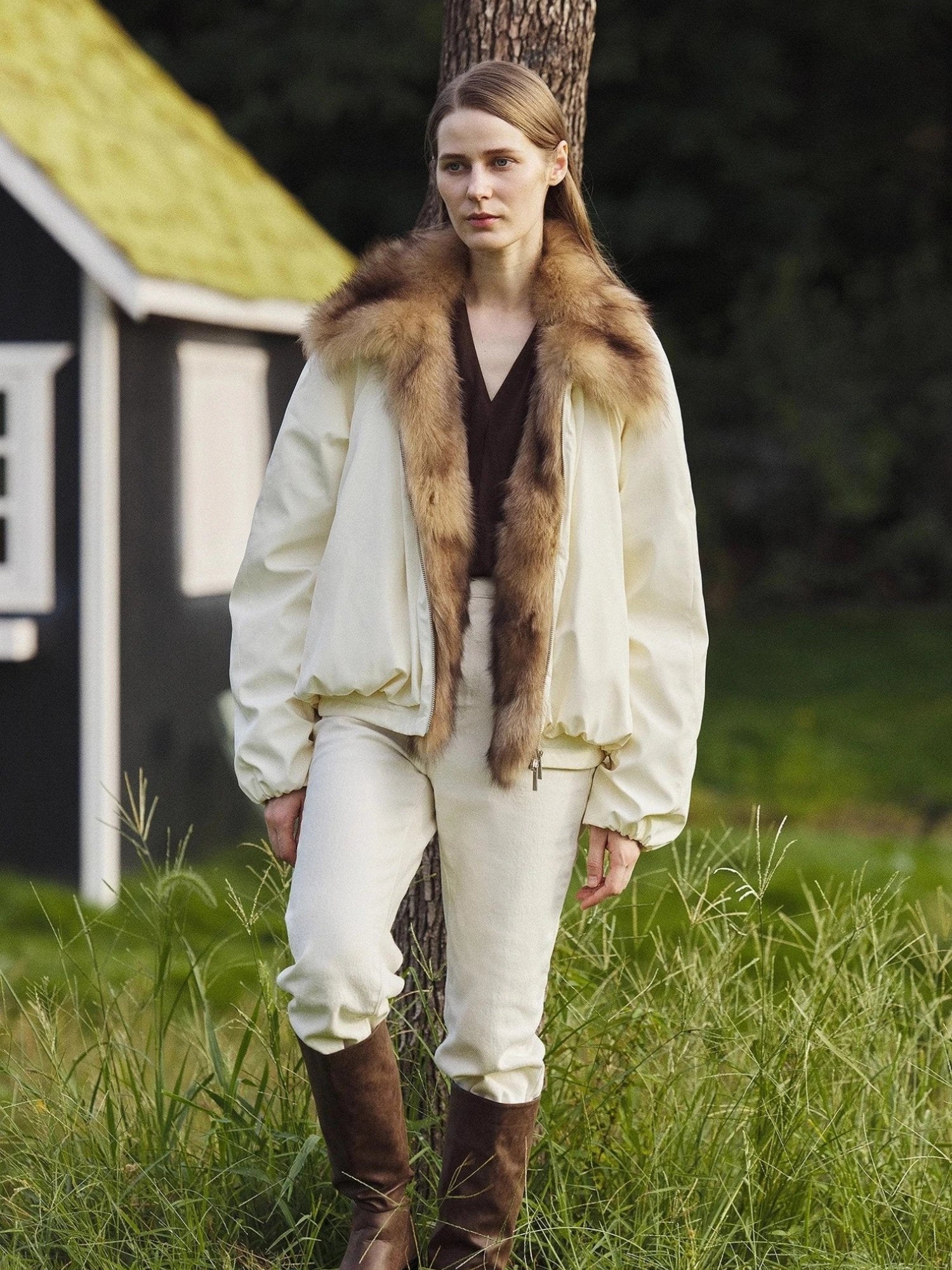 Outdoor model view of Fireladyfur Day and Night Rider off-white down jacket with fox fur collar