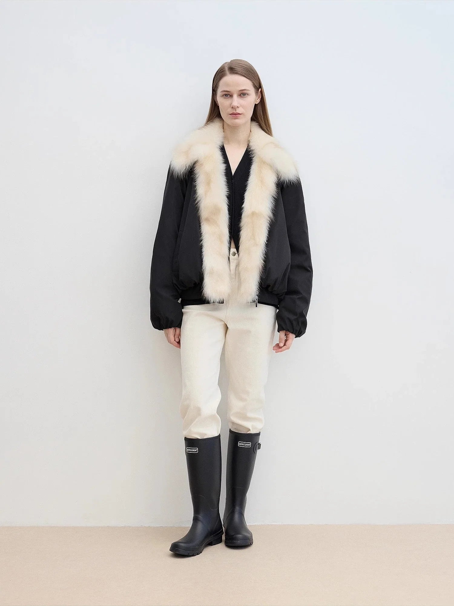 Full-body front model view of Fireladyfur Day and Night Rider black down jacket with contrasting fox fur collar