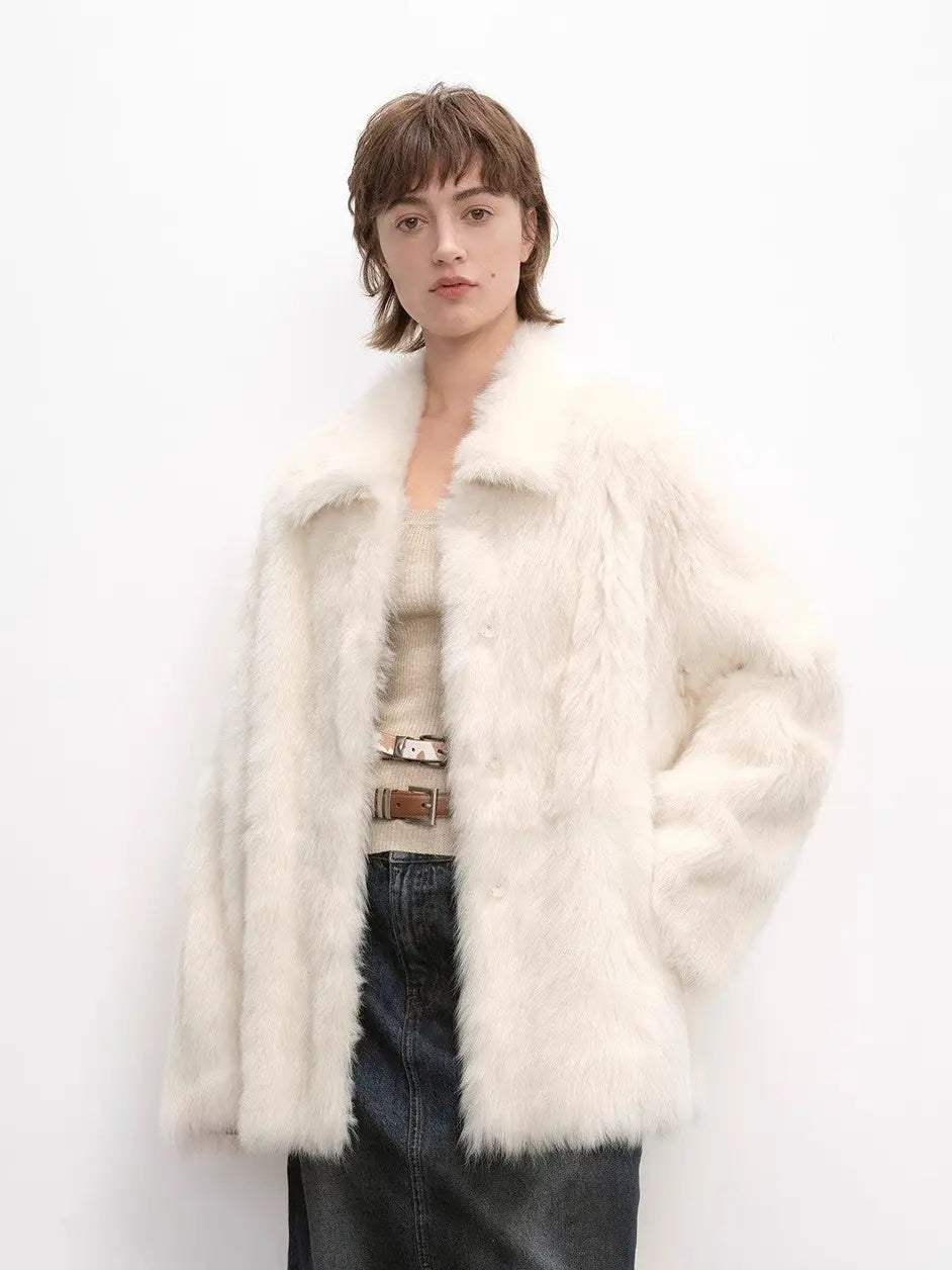 Woman wearing the Autumn Exclusive off-white Toscana shearling coat, front view