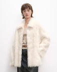 Woman wearing the Autumn Exclusive off-white Toscana shearling coat, front view