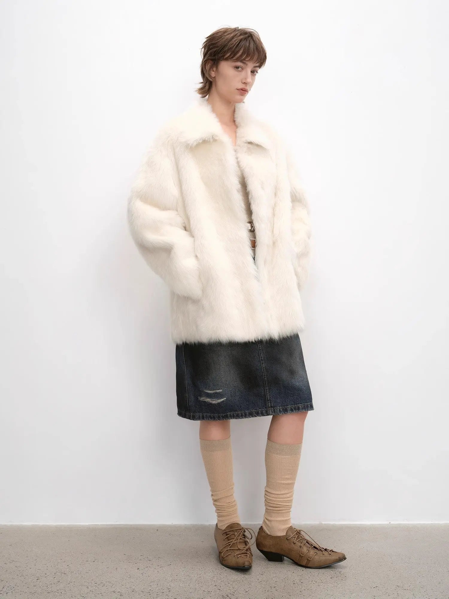 Woman styling the Autumn Exclusive off-white shearling coat, full-length view