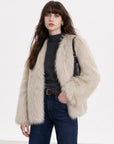 Model wearing Black Sugar Beige Apricot fox fur cardigan, front view