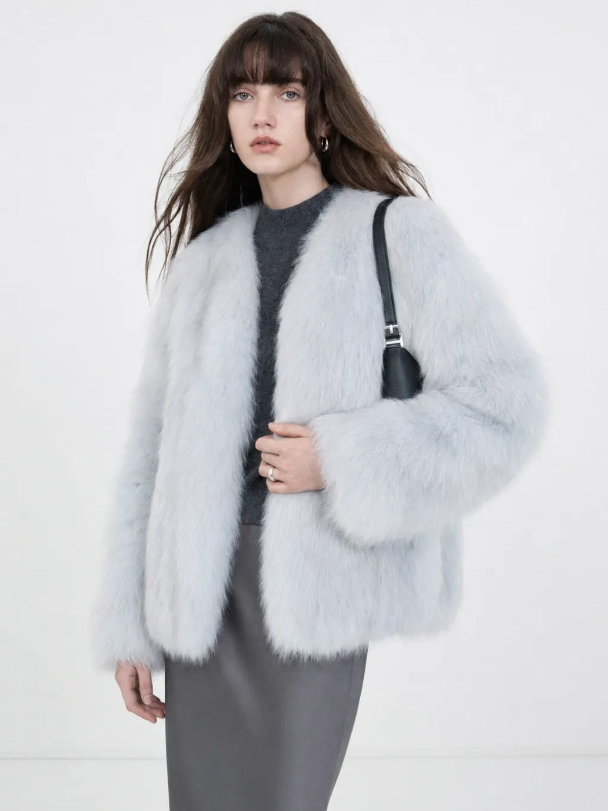 Model wearing Black Sugar Light Blue fox fur cardigan, front view