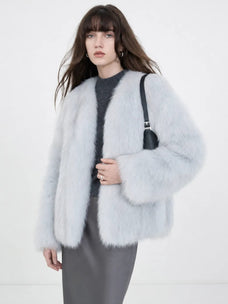 Model wearing Black Sugar Light Blue fox fur cardigan, front view