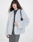 Model wearing Black Sugar Light Blue fox fur cardigan, front view