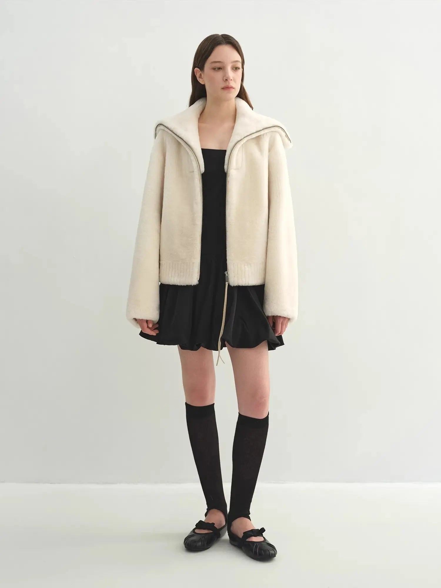 Model wearing the Butter Crisp pearl white Merino shearling leather coat, full-length view