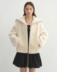 Model wearing the Butter Crisp pearl white Merino shearling leather coat, relaxed front view
