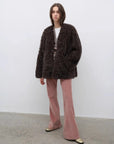Model wearing the Castle Dusk camel brown V-neck Toscana shearling coat, full-length view