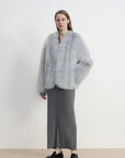 Model styling Champagne Ice Blue fox fur coat with hand in pocket