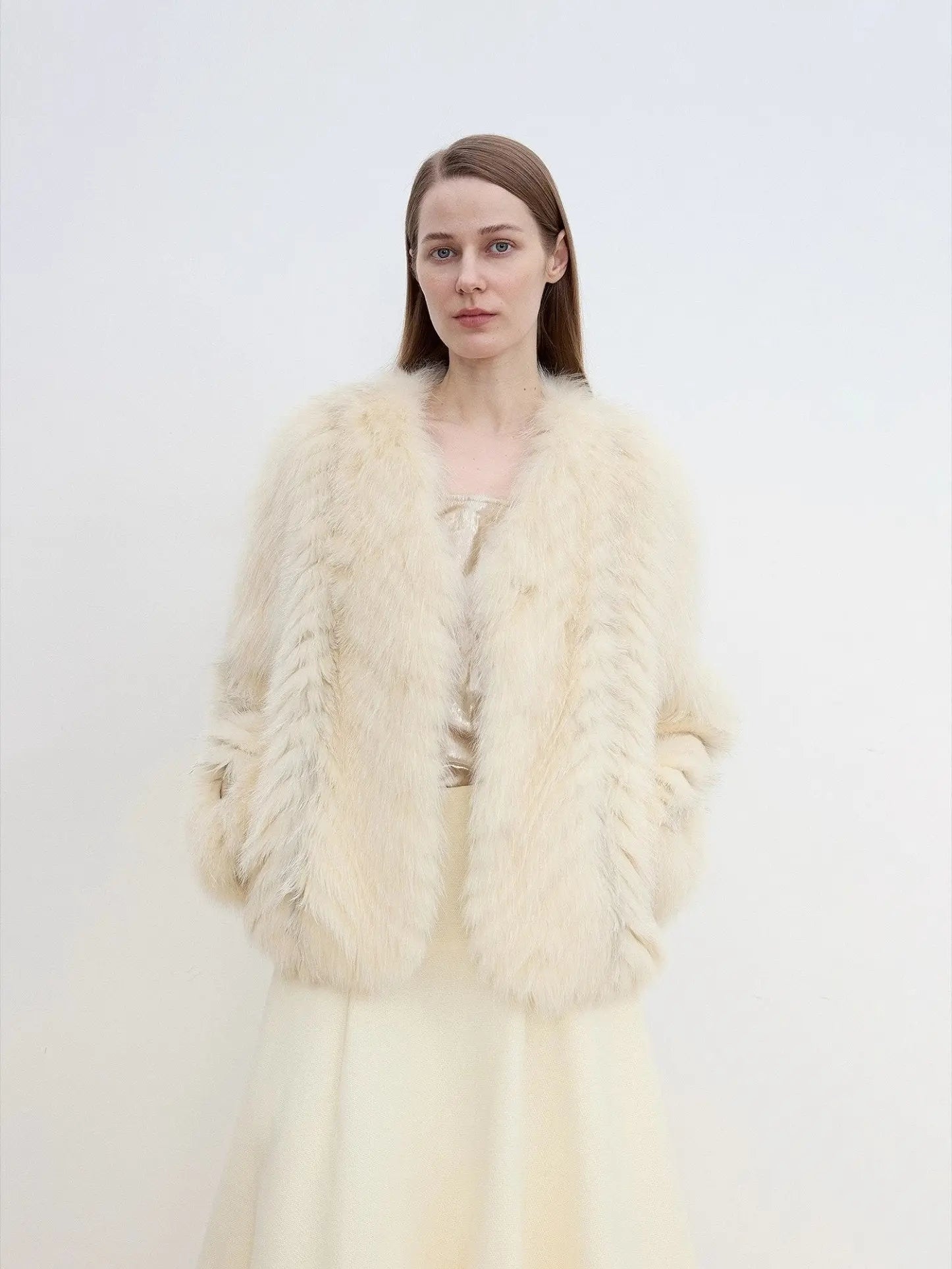 Model wearing Champagne Light Yellow SagaFurs fox fur coat, front view