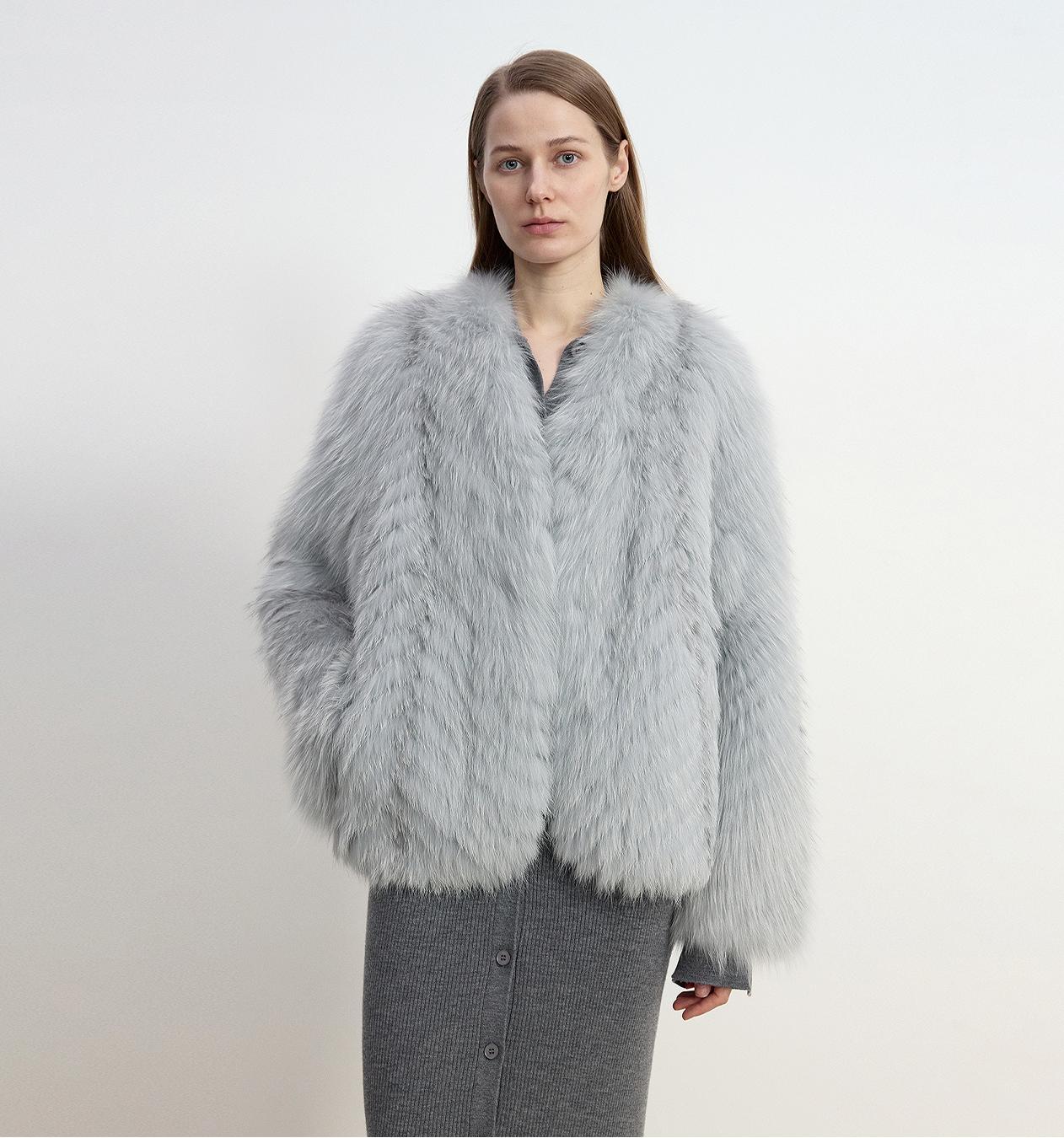 Light fox fur jacket styled as a texture-led winter statement