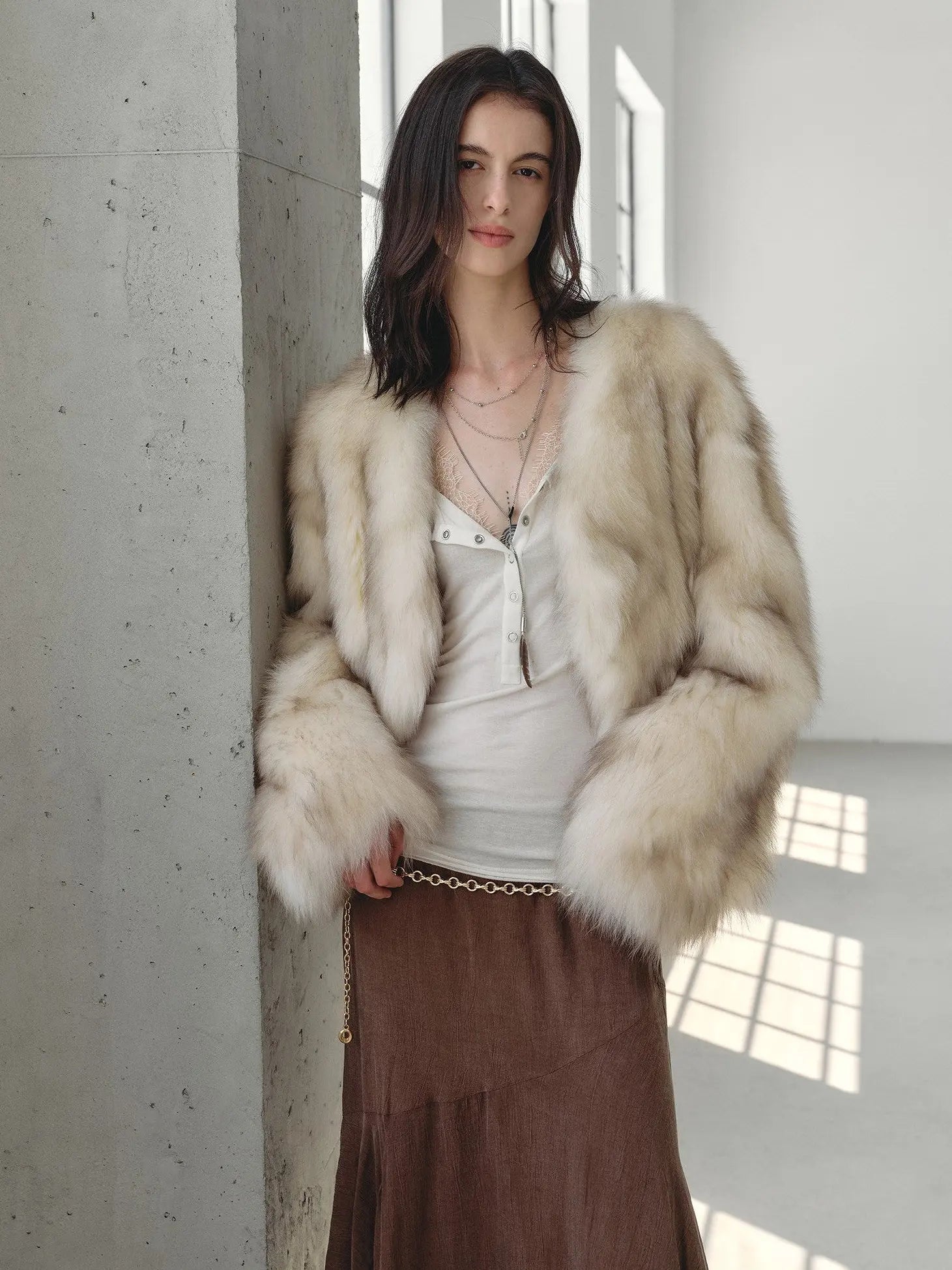 Chic Sister Apricot Brown V-neck fox fur coat in a natural-light setting