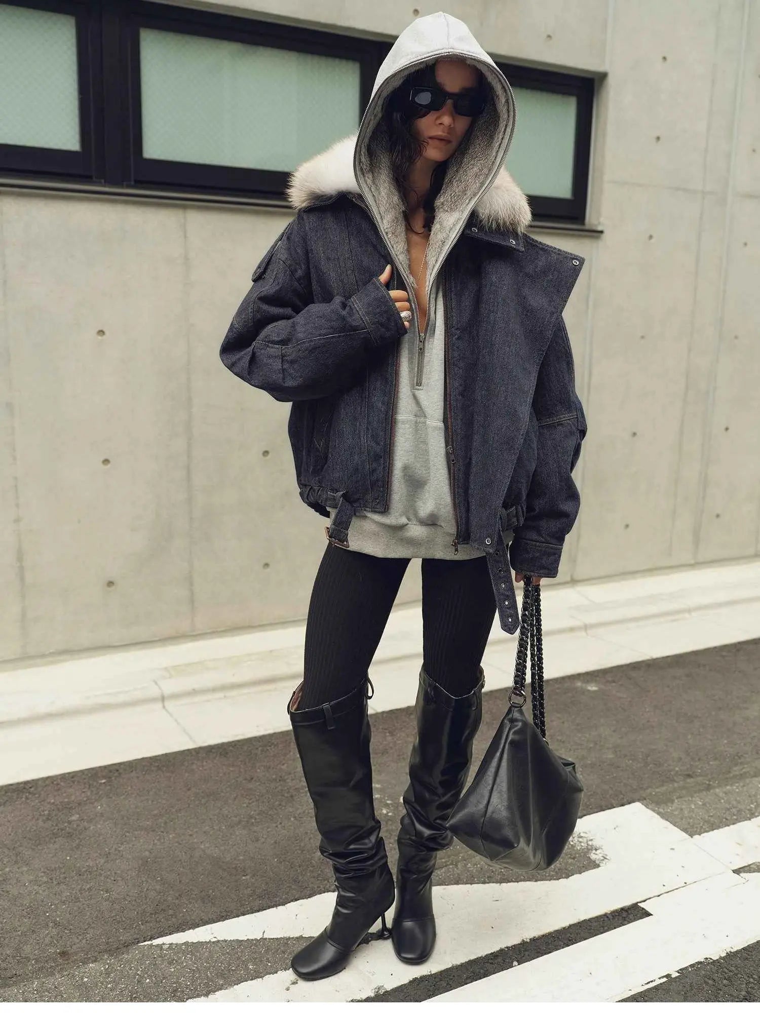 Model wearing Fireladyfur City Travel Denim Blue hooded down parka with detachable fox fur collar