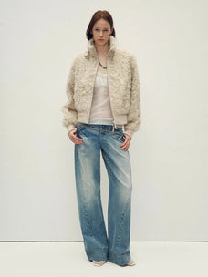 Model wearing the Curly Story light khaki sheep curly shearling bomber jacket, full-length view