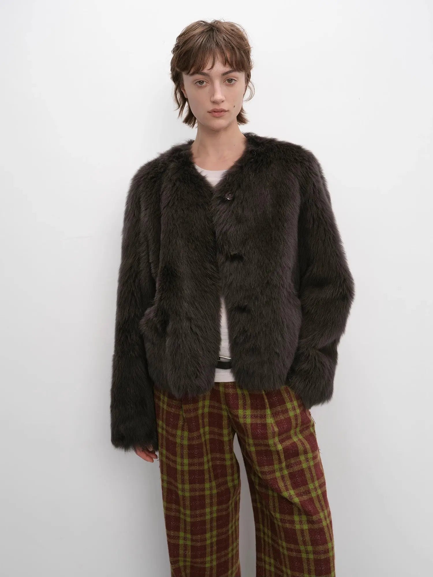 Woman wearing the Darcy Manor ink gray Toscana shearling coat, front view