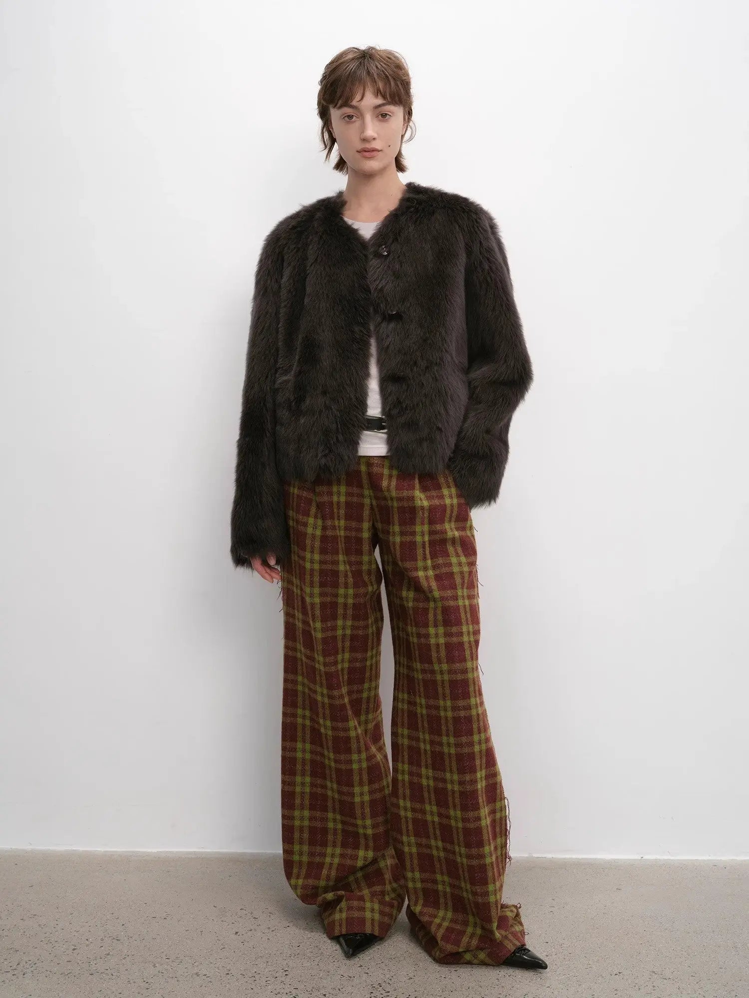 Woman styling the Darcy Manor ink gray Toscana shearling coat, full-length view