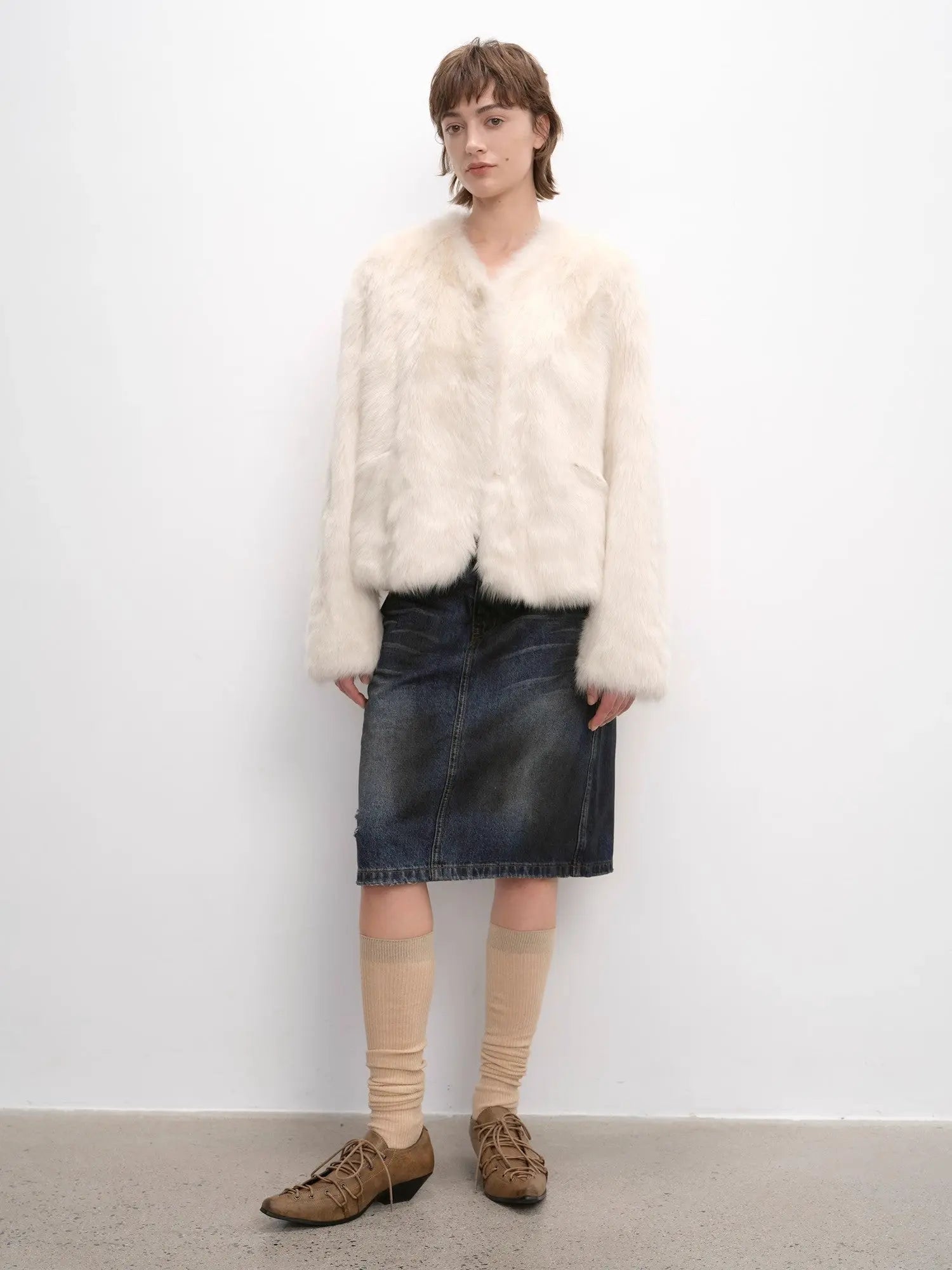 Woman styling the Darcy Manor white Toscana shearling coat, full-length view
