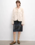 Woman styling the Darcy Manor white Toscana shearling coat, full-length view