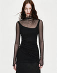 Black double-layer transparent oblique collar fake two-piece knit top on EVA model front view