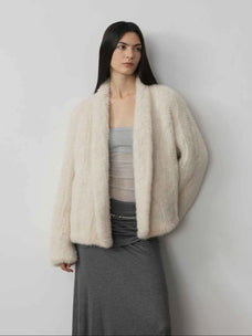Dream Traveler Pearly White mink coat on model, relaxed three-quarter view