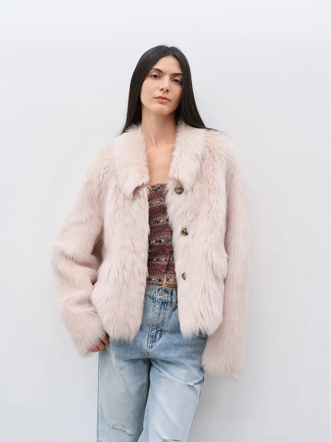Woman wearing the Dream Walk dirty pink Toscana shearling coat, front view