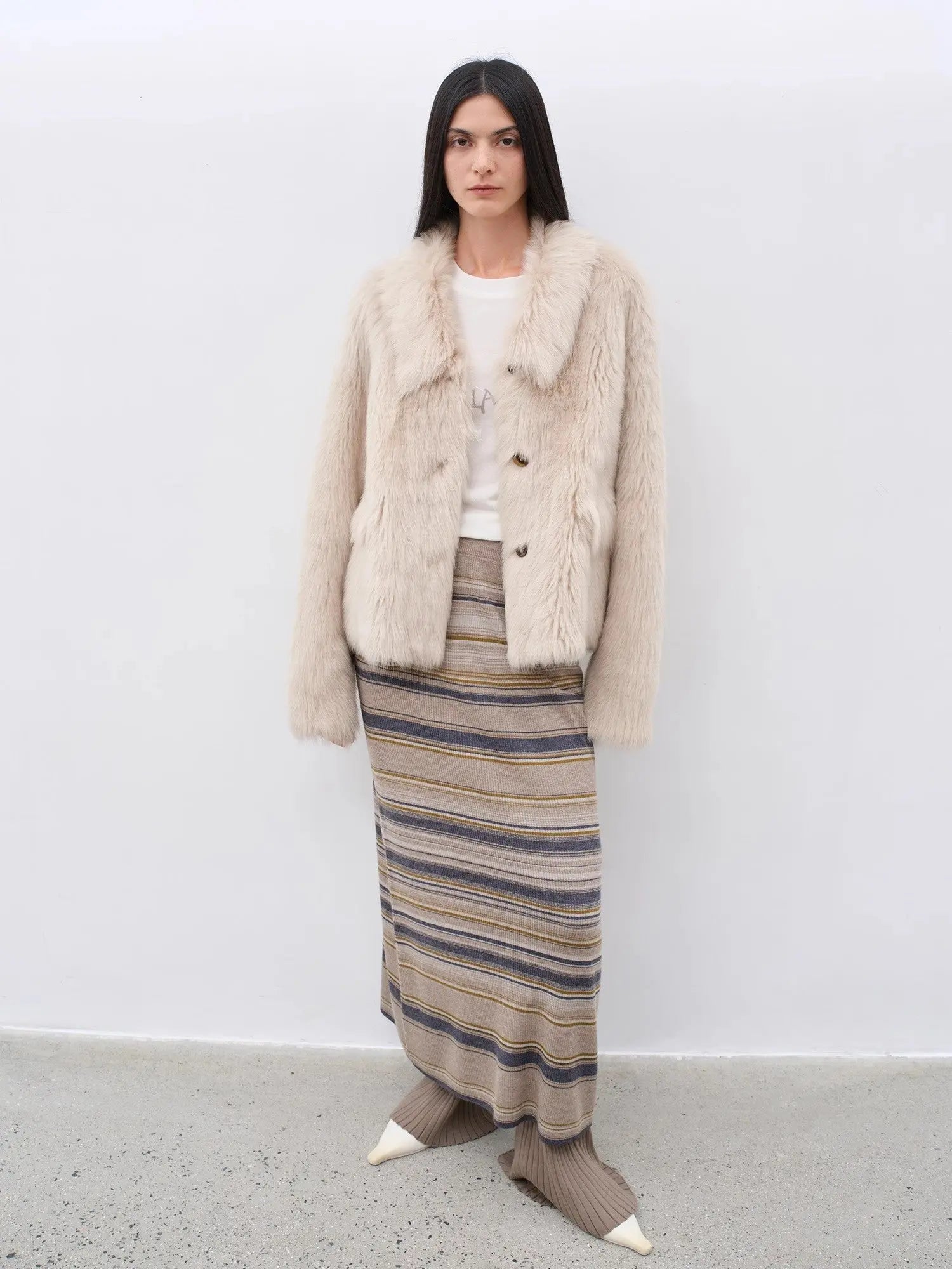 Woman wearing the Dream Walk land camel Toscana shearling coat, full-length view