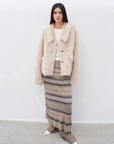 Woman wearing the Dream Walk land camel Toscana shearling coat, full-length view