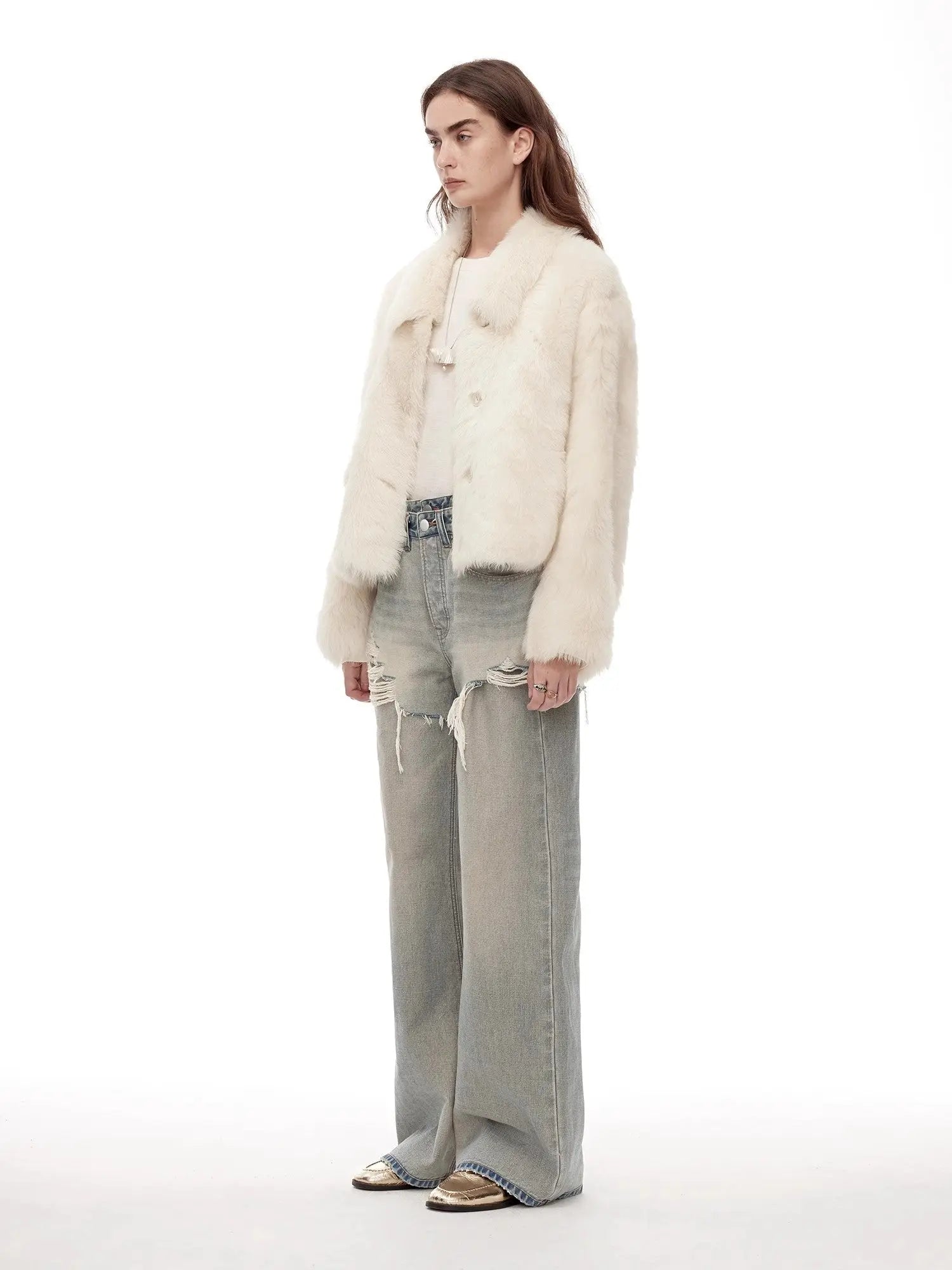Woman modeling the Dream Walk milky white shearling coat, side view