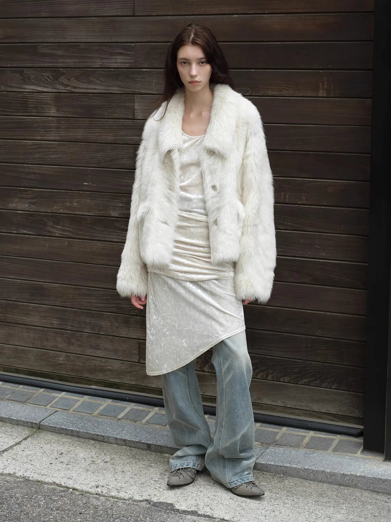 Woman styling the Dream Walk milky white Toscana shearling coat outdoors