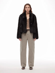 Woman wearing the Dream Walk texture black Toscana shearling coat, front view