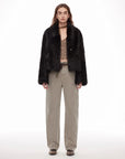 Woman wearing the Dream Walk texture black Toscana shearling coat, front view