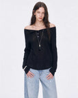 Firelady Fur Fashion Law black off-shoulder raglan sleeve top front detail on EVA model