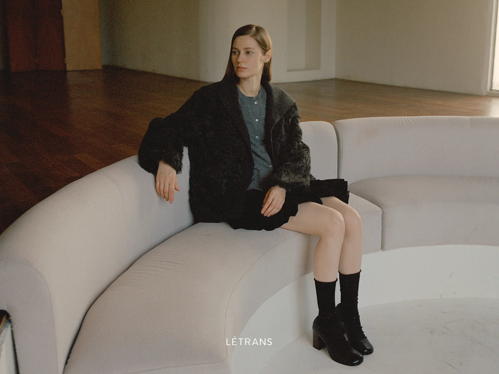 Black fur styling with a quiet evening base and visible boots