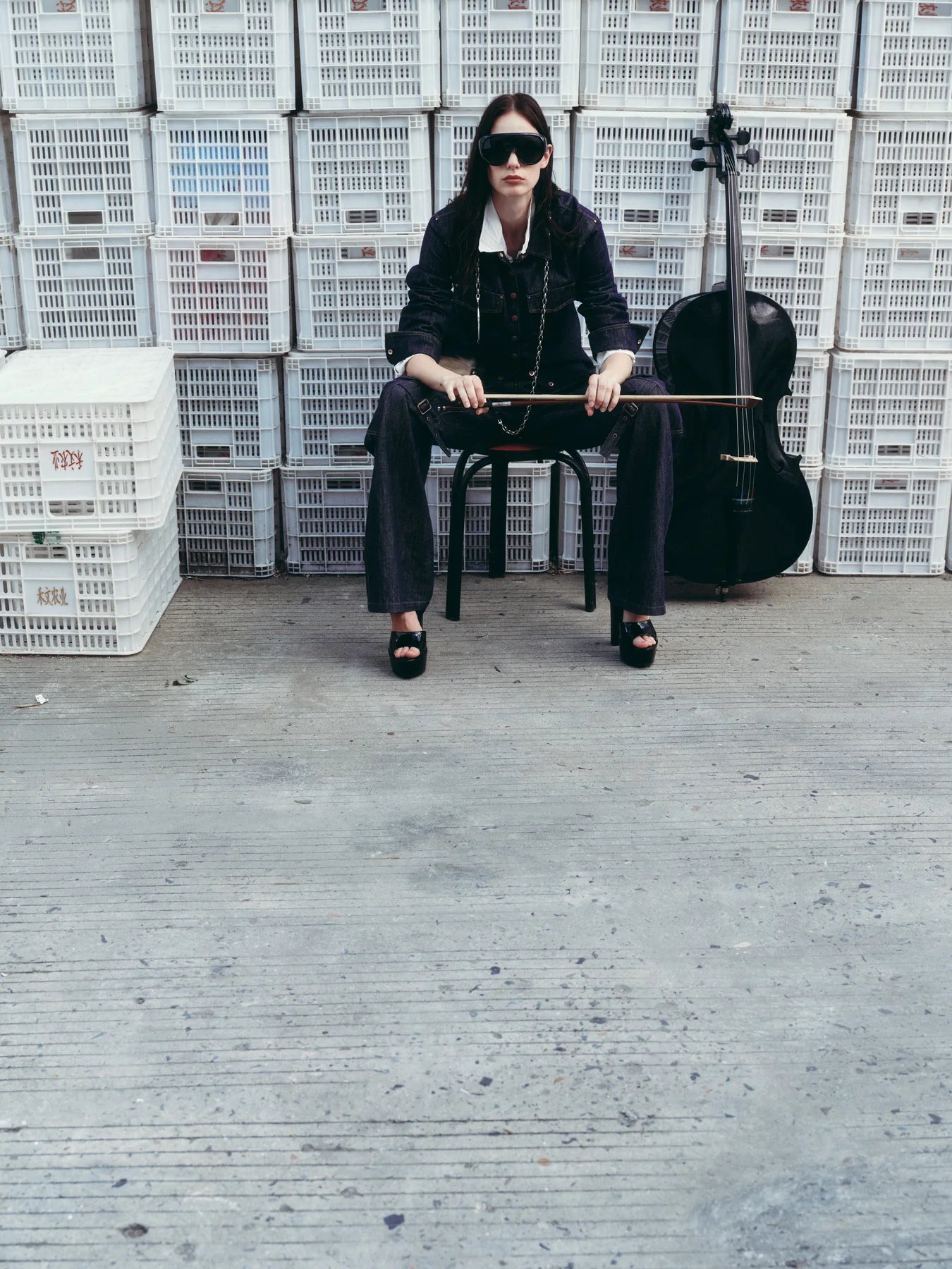 Black outfit photographed full length to show lower-half balance