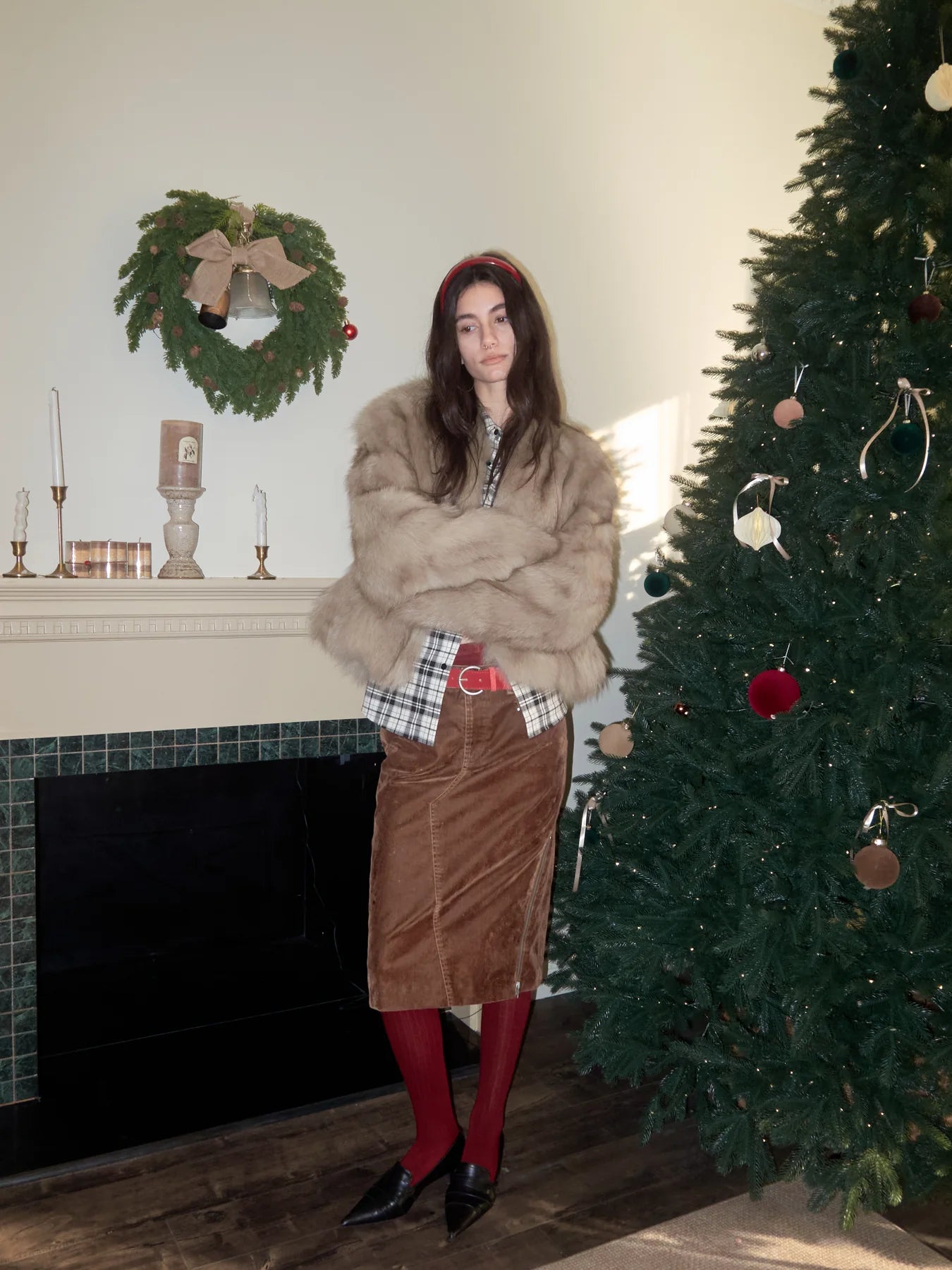 Holiday fur outfit with red boots for controlled festive contrast