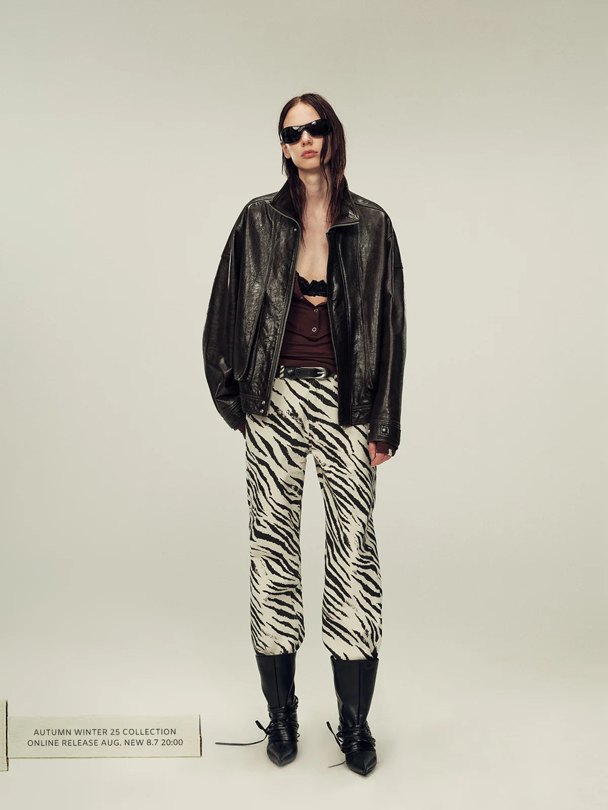 Black jacket outfit with patterned trousers and grounded shoes