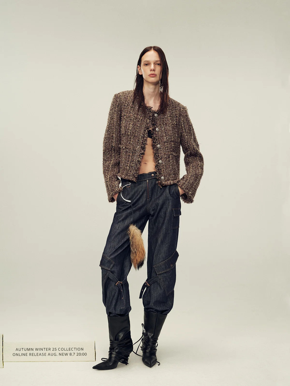 Brown jacket outfit with boot line and denim for smooth lower texture