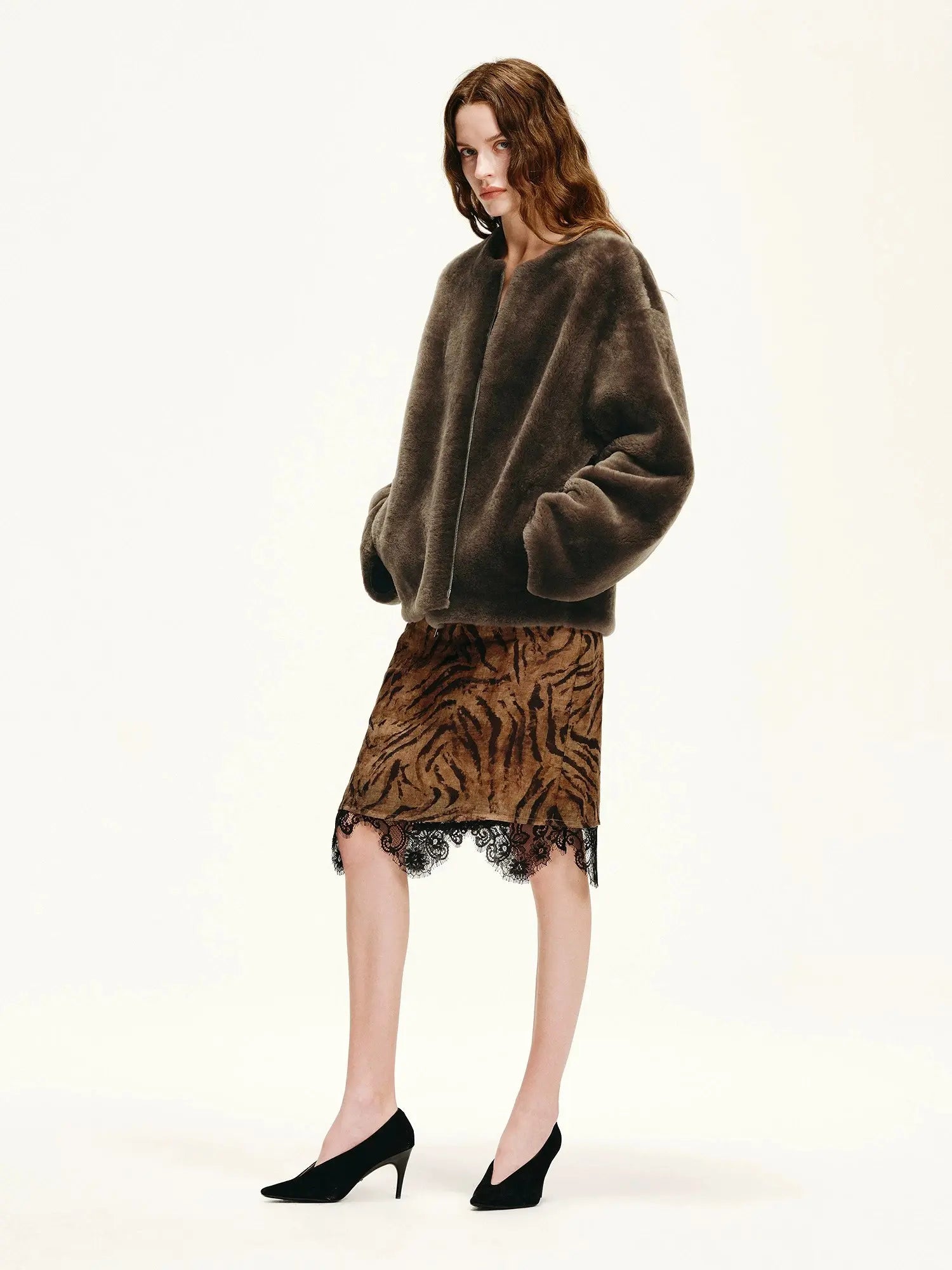 Dark brown Merino shearling jacket side view with relaxed sleeve