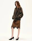 Dark brown Merino shearling jacket side view with relaxed sleeve
