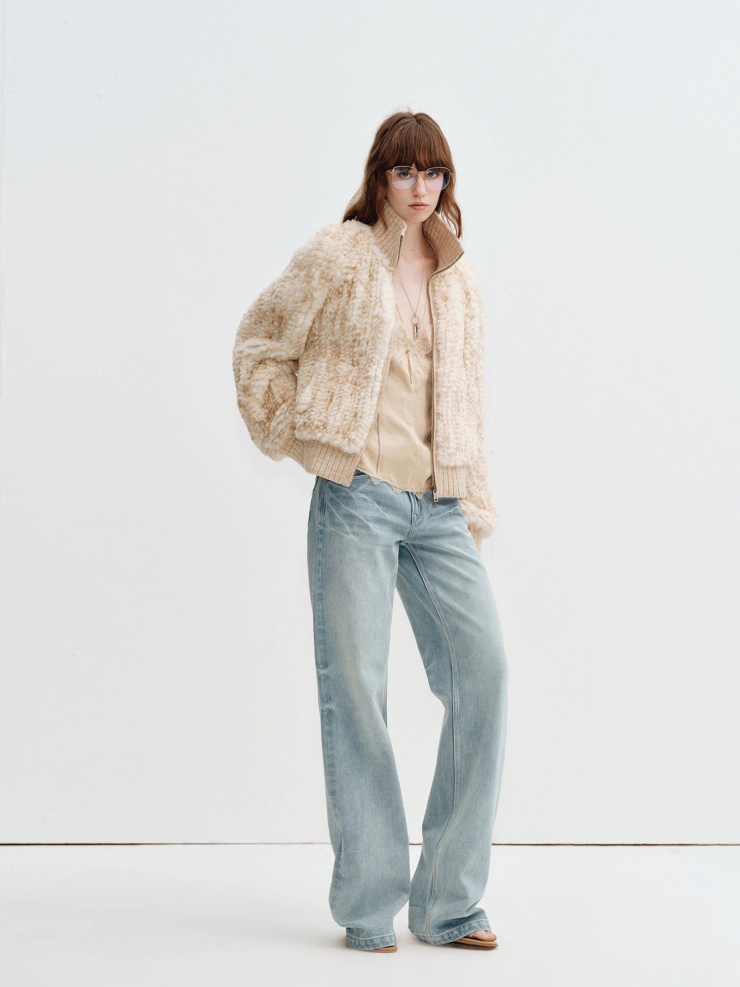 Model wearing Firelady Fur William Cream Frost rex rabbit fur knit jacket in Cream Apricot full length